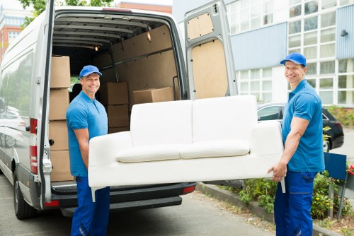 Office removals planning in Clapham Park with moving boxes and desks