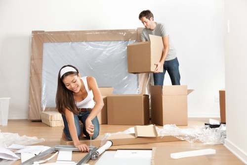 Office removals planning in Claphampark with moving boxes and workspace setup