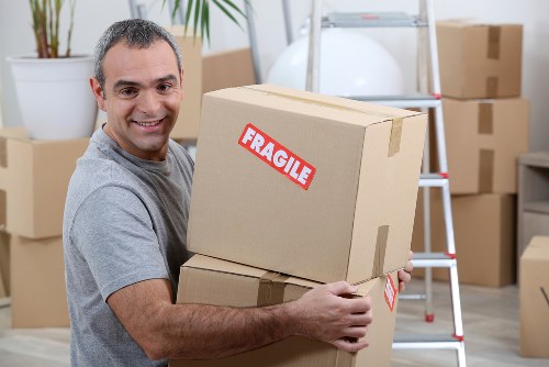 Loading household furniture into a removals van in Clapham Park