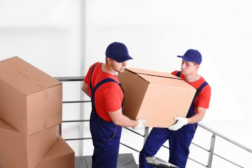 Moving team protecting items during a Claphampark van service