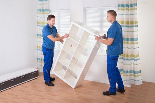 Boxes and household items being arranged inside a removal van